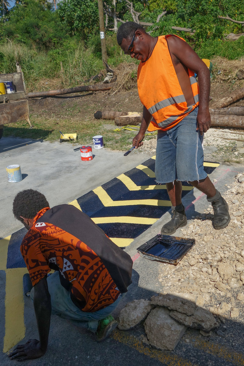 Painting speedbumps by hand