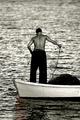 Fisherman bringing in net