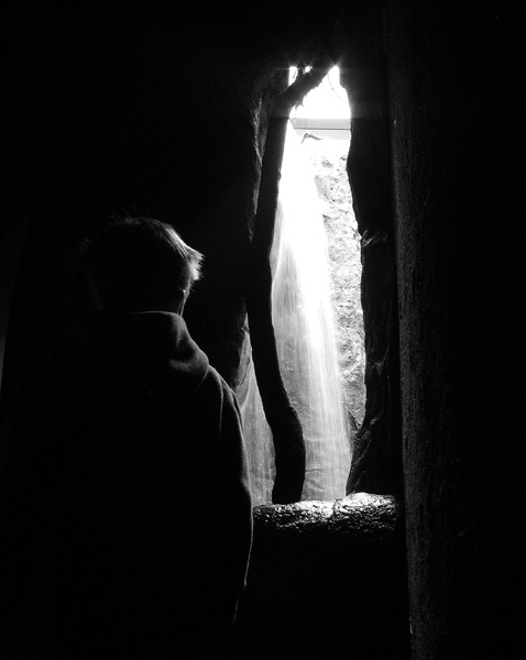 Silhouette by waterfall