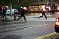 Three suits in the rainstorm