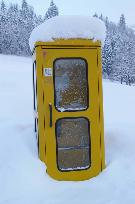 Snowed in telephone booth