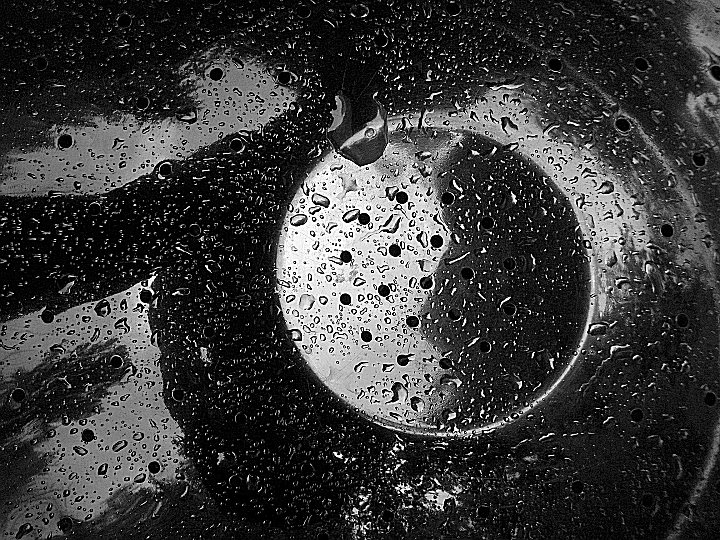 shiny colander in rain