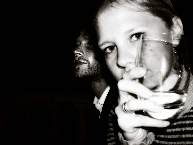 Hiding behind a glass of champagne- Deauville Film Festival - 2006