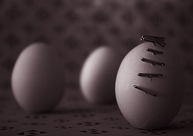 stabbed egg with bystanders (still life outtake)