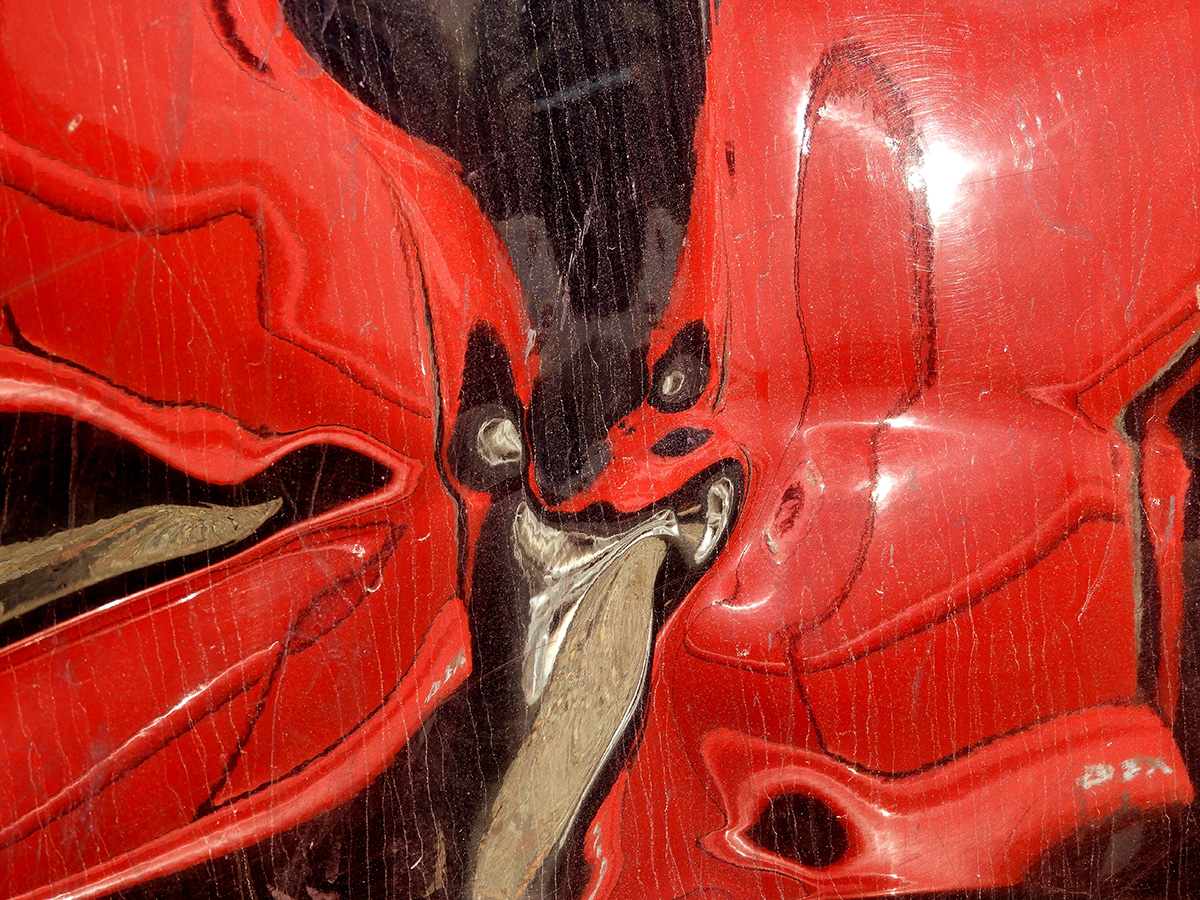 Wrecked Red Car Reflected on a Wrecked Black Car