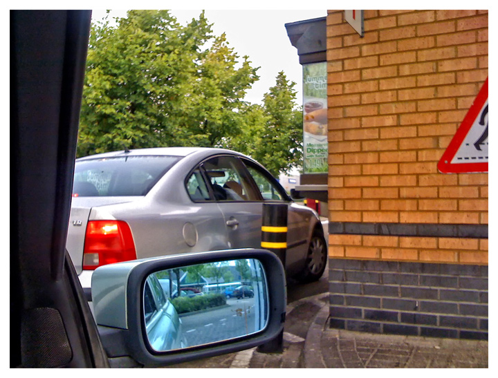 a McReflection in my McMirror at the McSlow drive through (iphone)